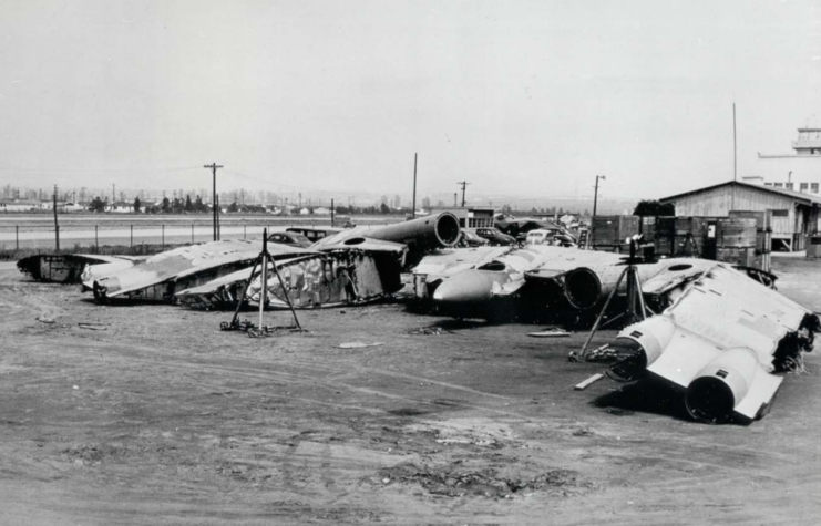 Aircraft parts strewn across an airfield
