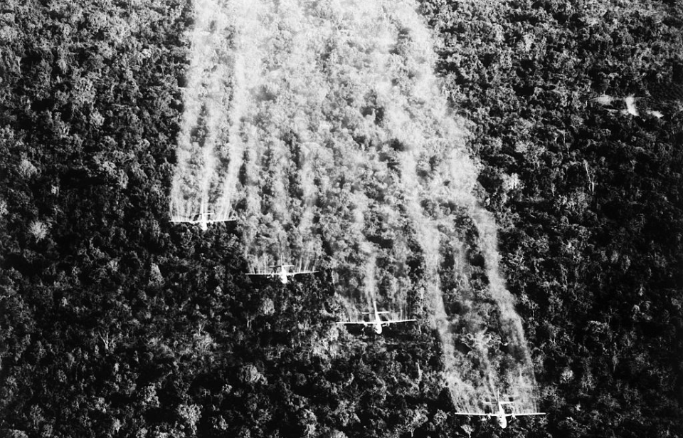 Four Fairchild C-123 Providers spraying Agent Orange over a Vietnamese jungle