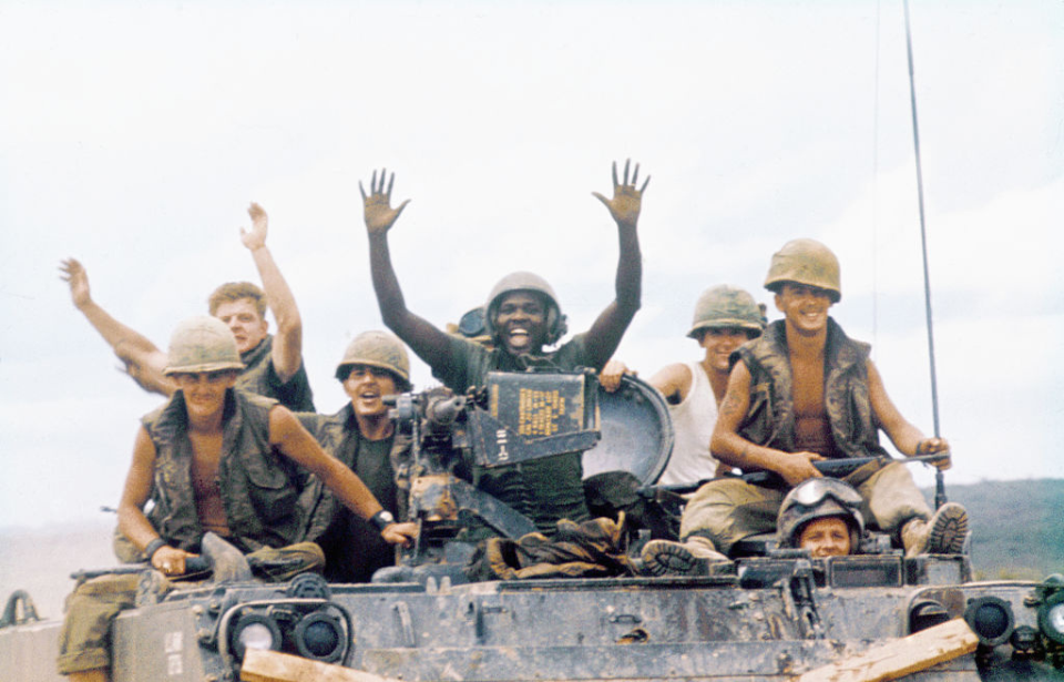 American troops riding in an armored personnel carrier