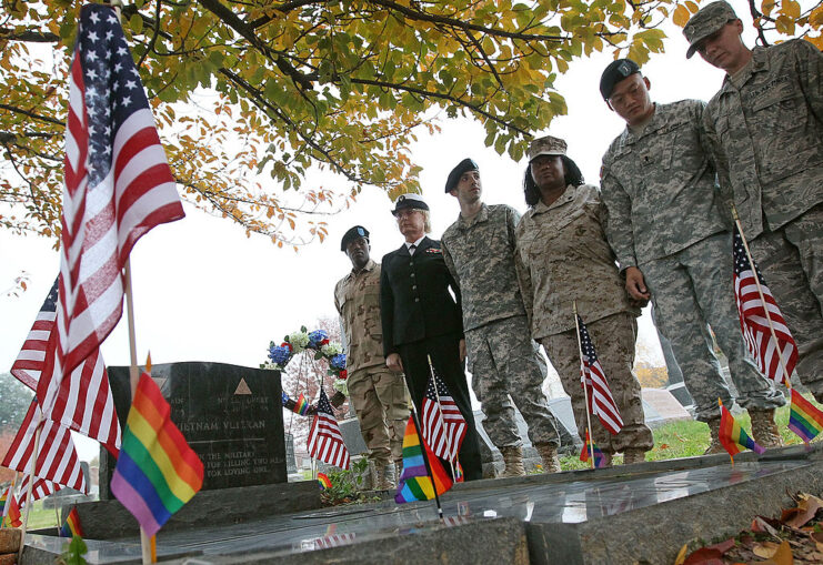 Retired US military members standing at Leonard Matlovich's grave