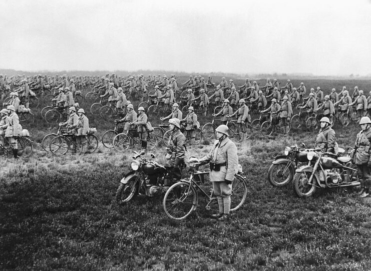 Dutch soldiers standing with their bicycles in a field