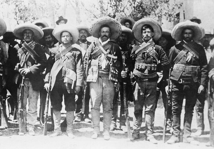 Francisco "Pancho" Villa standing with a number of Mexican revolutionaries