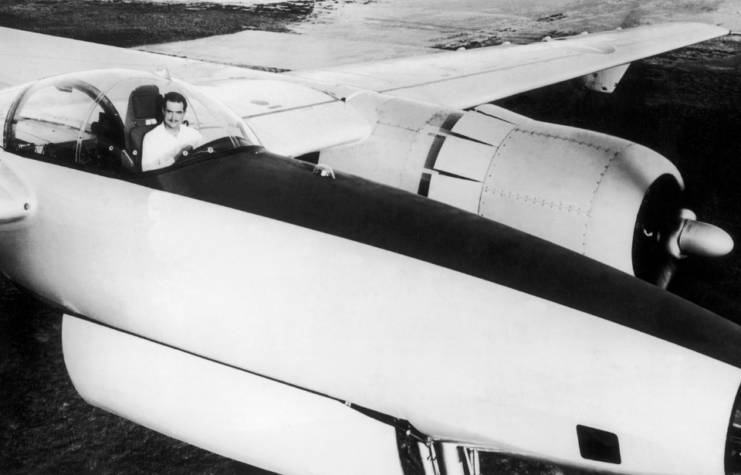 Howard Hughes sitting in the cockpit of a Hughes XF-11