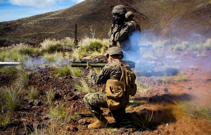 US Marine firing an M72 LAW while another watches