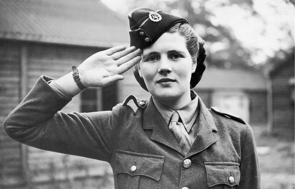 Mary Soames (née Spencer-Churchill) saluting in uniform