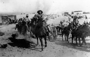 Francisco "Pancho" Villa and other Mexican revolutionaries on horseback