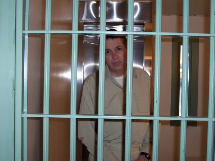 Robert Hanssen standing in his prison cell