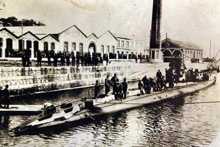 SM UC-56 at port, with people standing around and on the U-boat