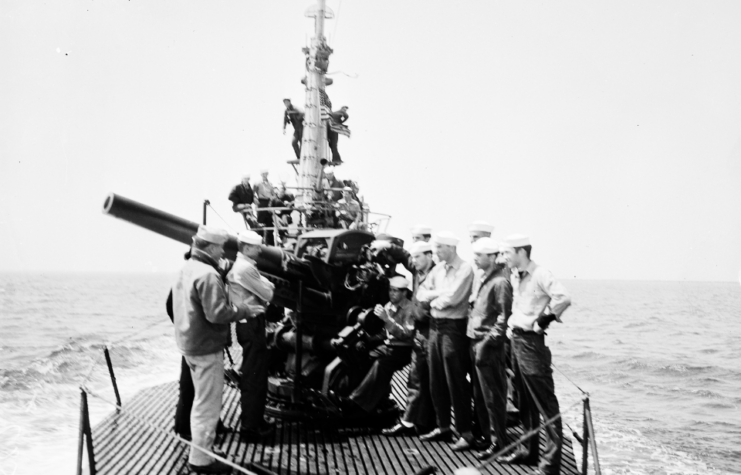 Crewmen standing atop the USS Stickleback (SS-415) while at sea