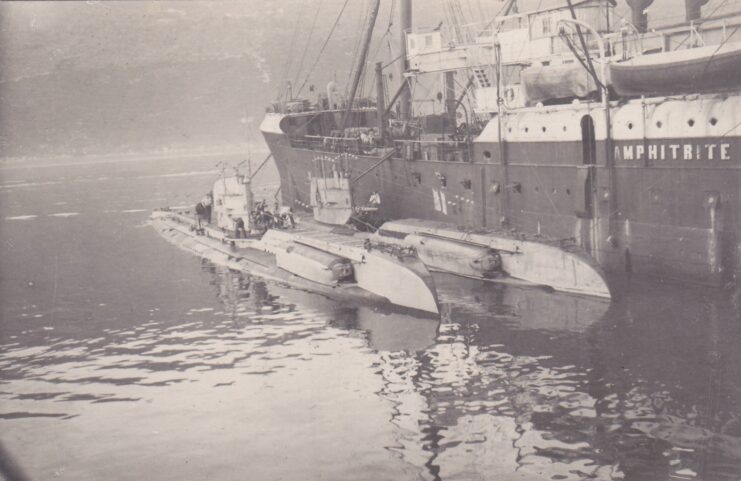 Two Type UC II U-boats anchored next to a ship