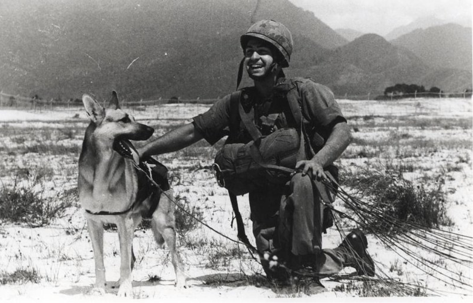 Frank Spano kneeling alongside his German Shepherd, Lobo