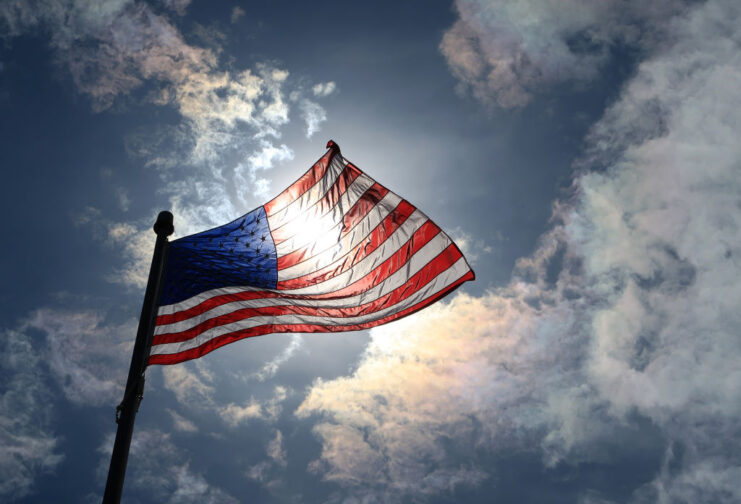 Sun shining through the American flag