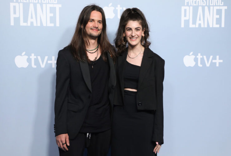 Anze Rozman and Kara Talve standing on a red carpet