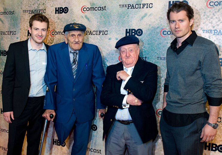 Joe Mazzello, Bill Guarnere, Edward "Babe" Heffron and James Badge Dale standing on a red carpet