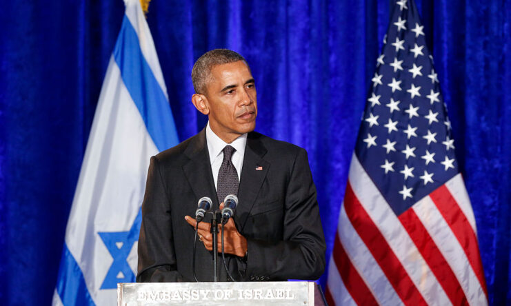 Barack Obama speaking at a podium