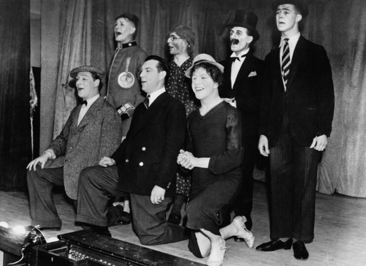 Ralph Reader performing with his troupe on stage