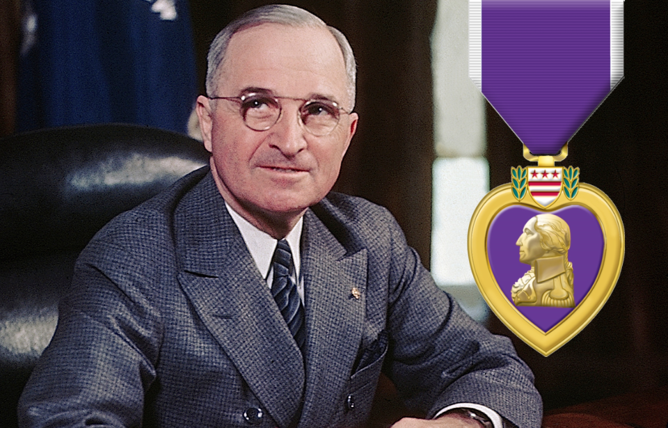 Harry Truman sitting at his desk + Purple Heart