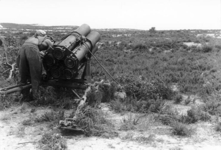 German soldier setting up a 21 cm Nebelwerfer 42 in the field