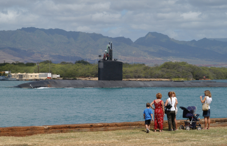 Family watching the USS Greeneville (SSN-772) leaving Pearl Harbor
