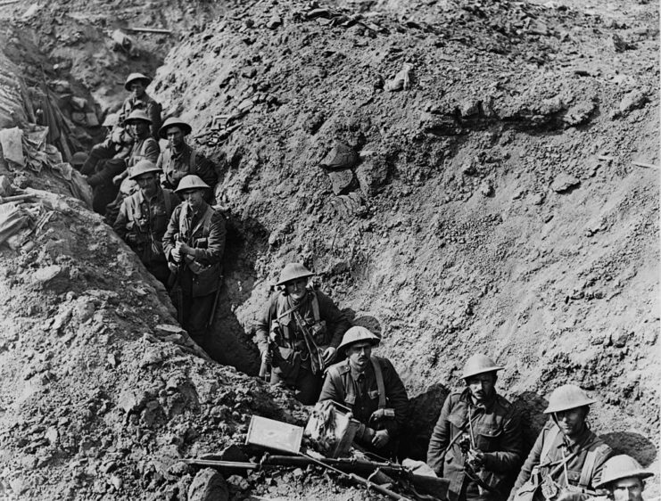 Troops walking through a trench