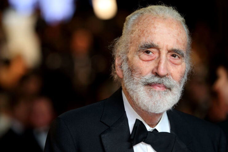Christopher Lee standing on a red carpet