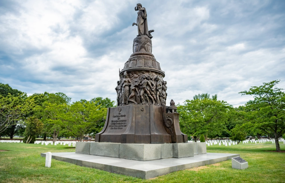 Confederate Memorial standing above Confederate graves at Arlington National Cemetery