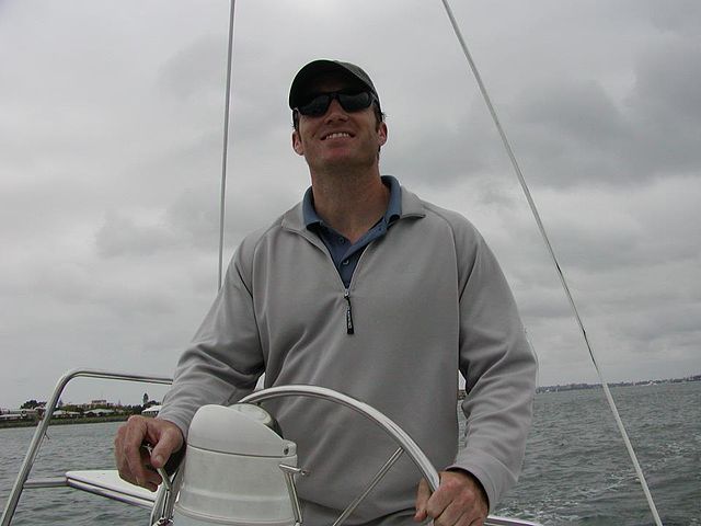 Glen Doherty at the helm of a boat