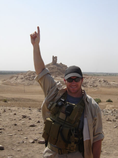 Glen Doherty standing in front of the Tower of Babel