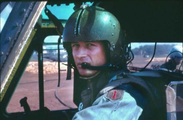 Larry Taylor sitting in the cockpit of a Bell UH-1 Iroquois