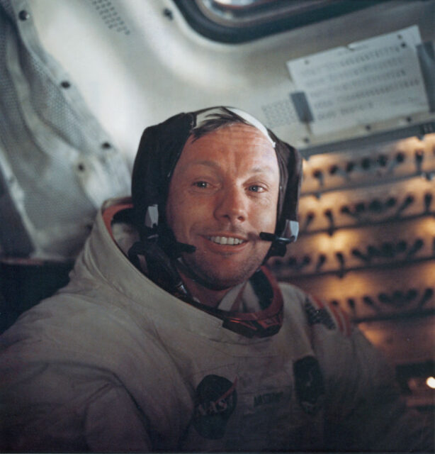 Neil Armstrong sitting in a Lunar Module