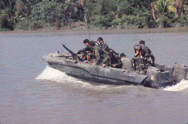 Members of SEAL Team 1 riding in a SEAL team assault boat (STAB)
