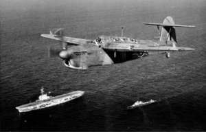 Fairey Barracuda flying over the HMS Vulnerable (R63) and an Italian destroyer