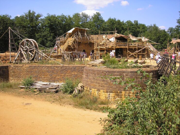 Tourists walking around the construction site at Guédelon Castle