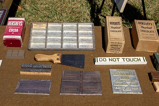 Hershey's products, including two Tropical Bars, placed on a wooden table