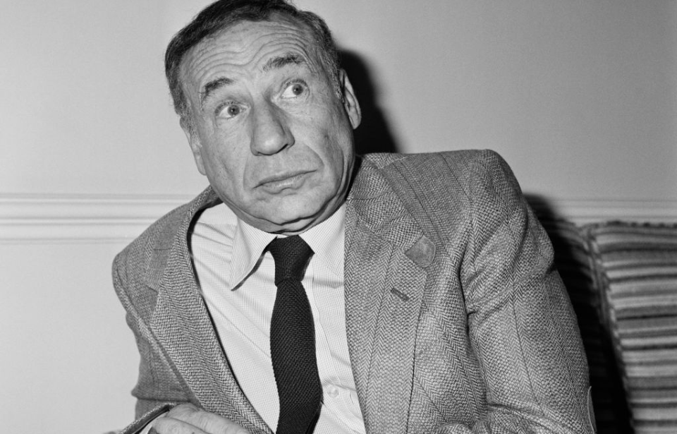 Mel Brooks sitting on a couch