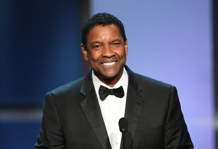 Denzel Washington speaking at a podium