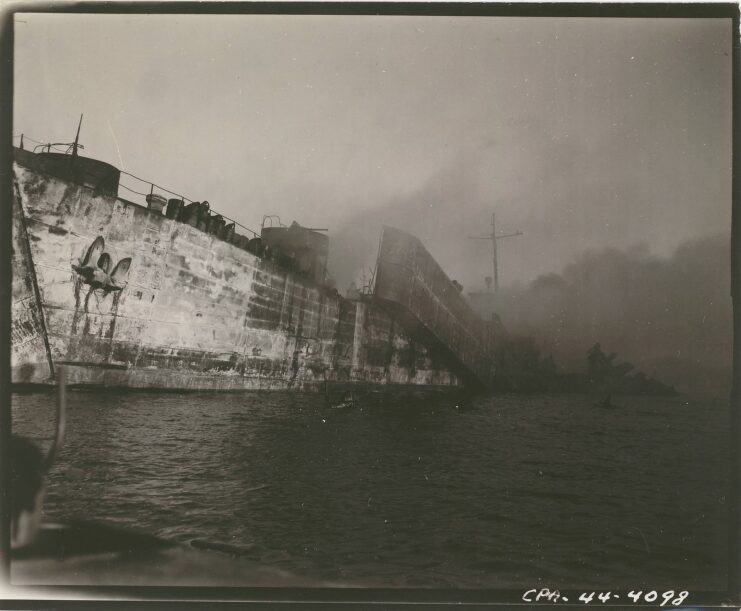 Smouldering remains of the USS LST-39 in the water