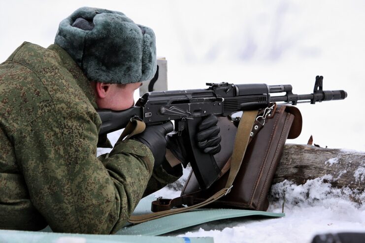 Russian soldier aiming an AK-74M in the snow
