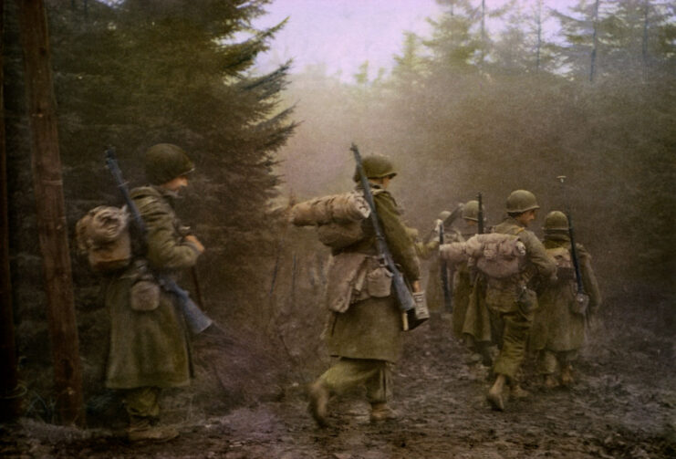 Airborne troops walking through a forest