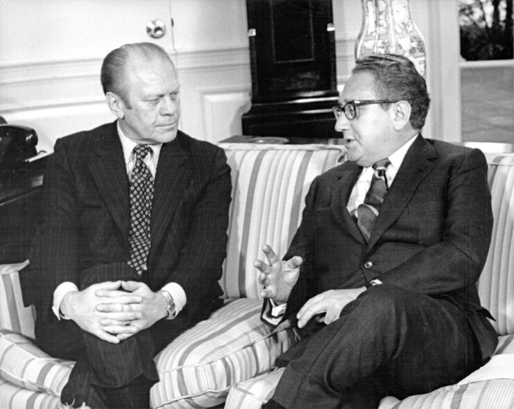 Gerald Ford and Henry Kissinger sitting together in the Oval Office