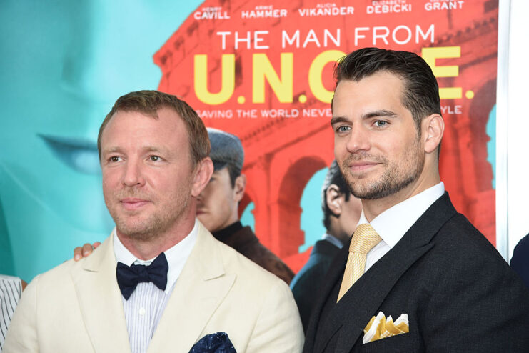 Guy Ritchie and Henry Cavill standing together on a red carpet