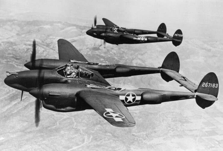 Two Lockheed P-38 Lightnings in flight