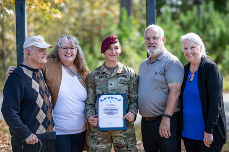 Maciel Hay standing with four members of her family