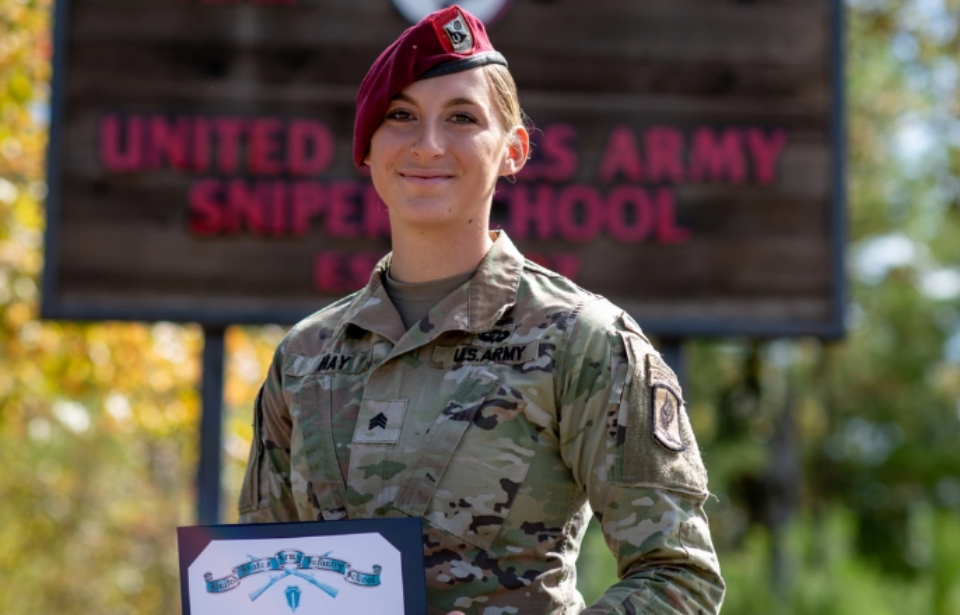 Maciel Hay holding her certificate from the US Army Sniper School