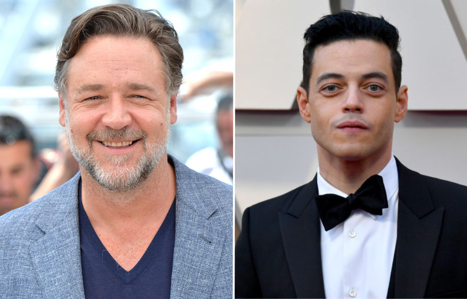 Russell Crowe standing on a red carpet + Rami Malek standing on a red carpet