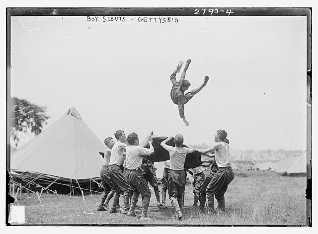 Boy Scouts flinging another into the air at the 1913 Gettysburg Reunion