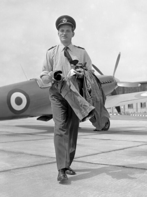 Johnnie Johnson walking away from a Supermarine Spitfire parked on the tarmac