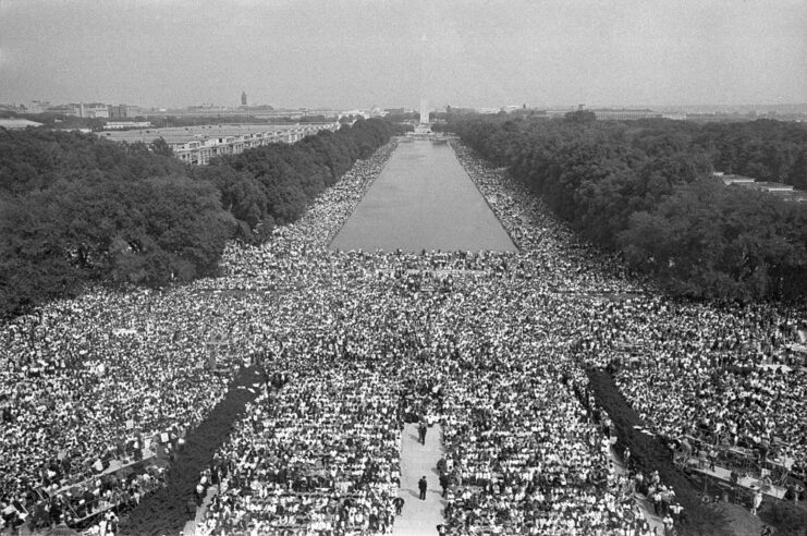 Large crowd gathered around the Reflecting Pool in Washington, DC