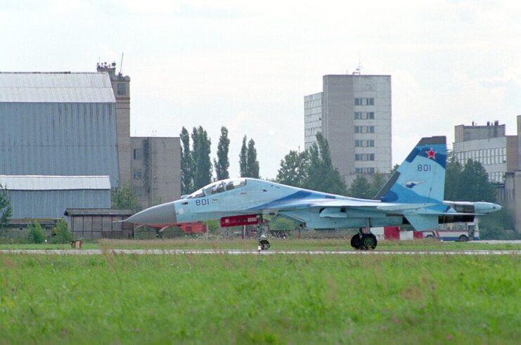 Sukhoi Su-35UB taxiing down a runway