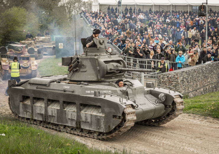 Tank driving around the track at the Tank Museum's arena